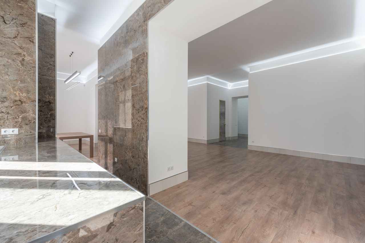 about-us-01 Explore this elegant, well-lit interior featuring marble accents and contemporary design.