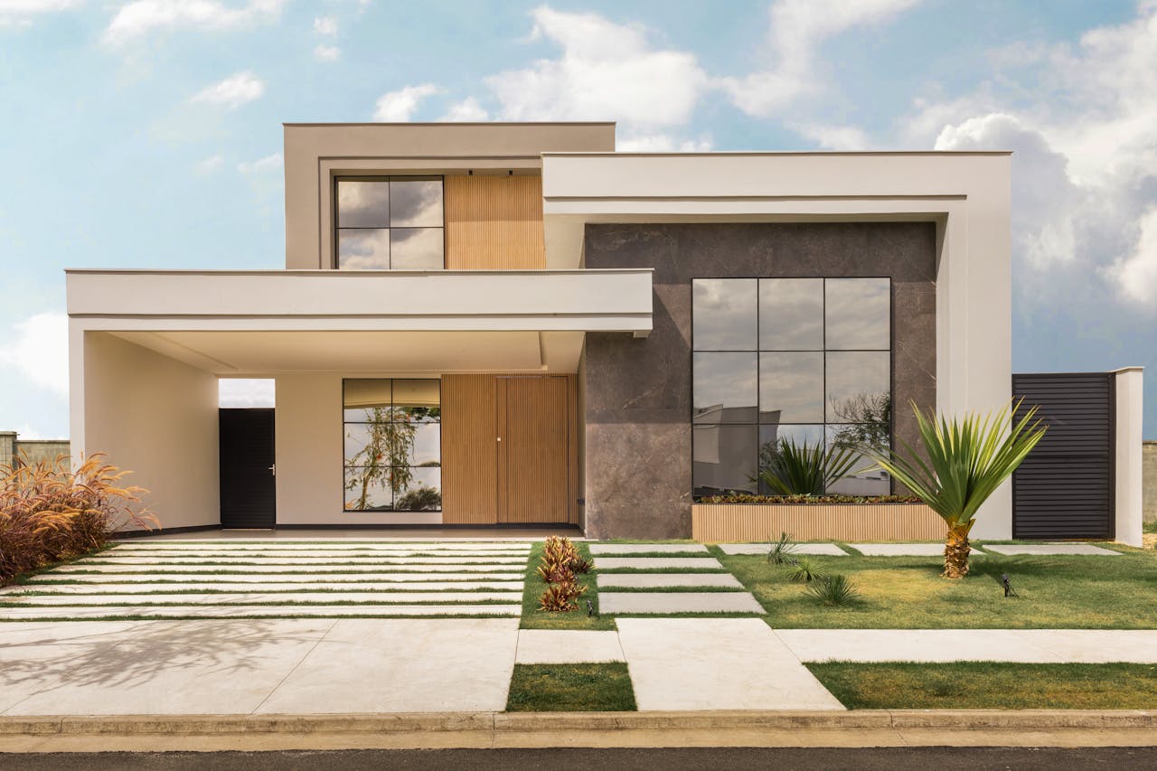 about-us-02 Contemporary house exterior with minimalist design, large windows, and landscaped front yard.